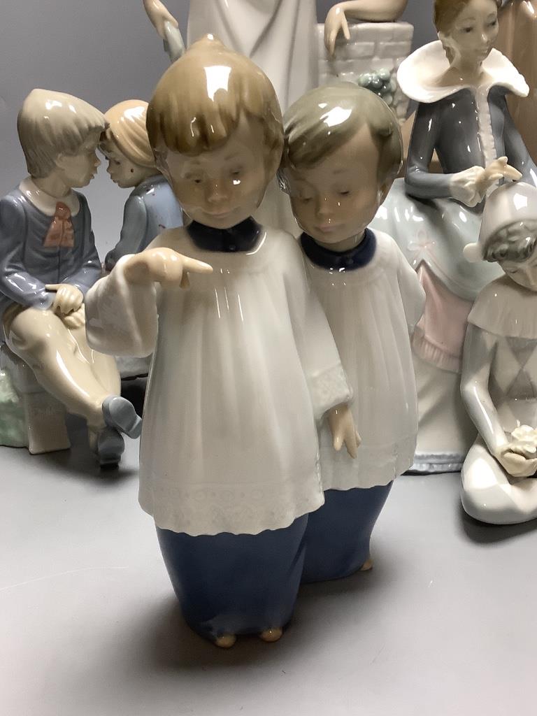 Four Nao figures and a Lladro group